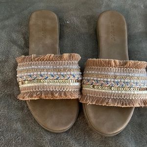 Multi color beige slide on sandals.